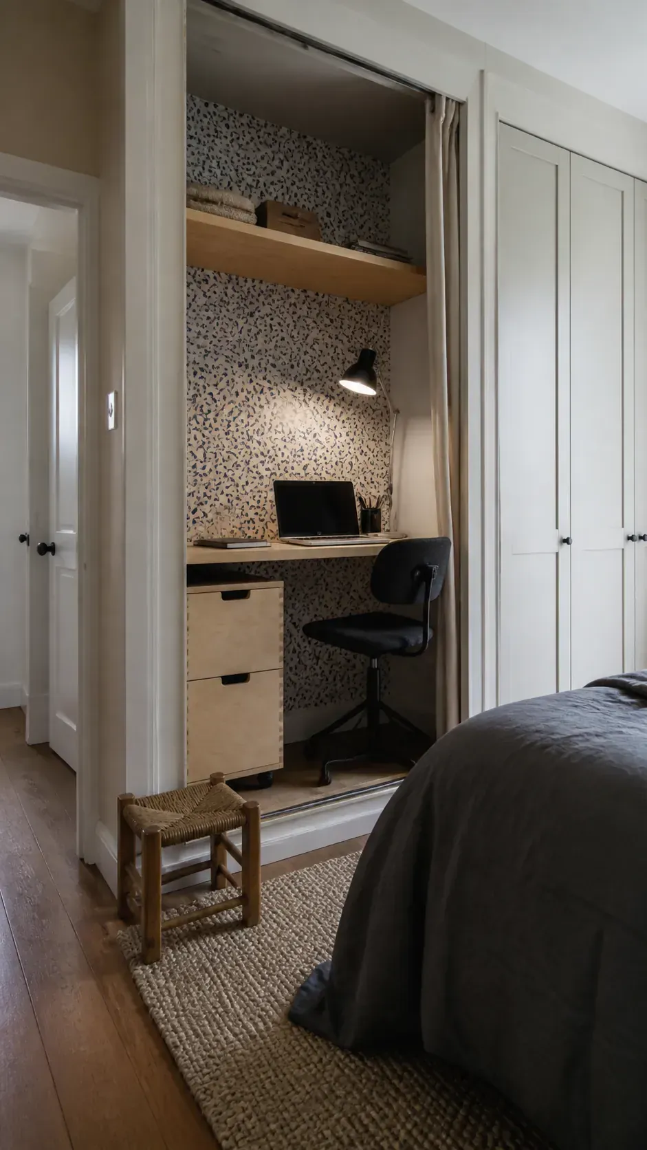 Bedroom desk fitted into an open wardrobe niche
