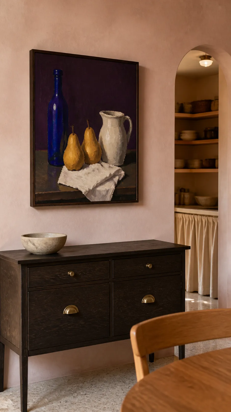 Modern still life painting above a kitchen side cabinet