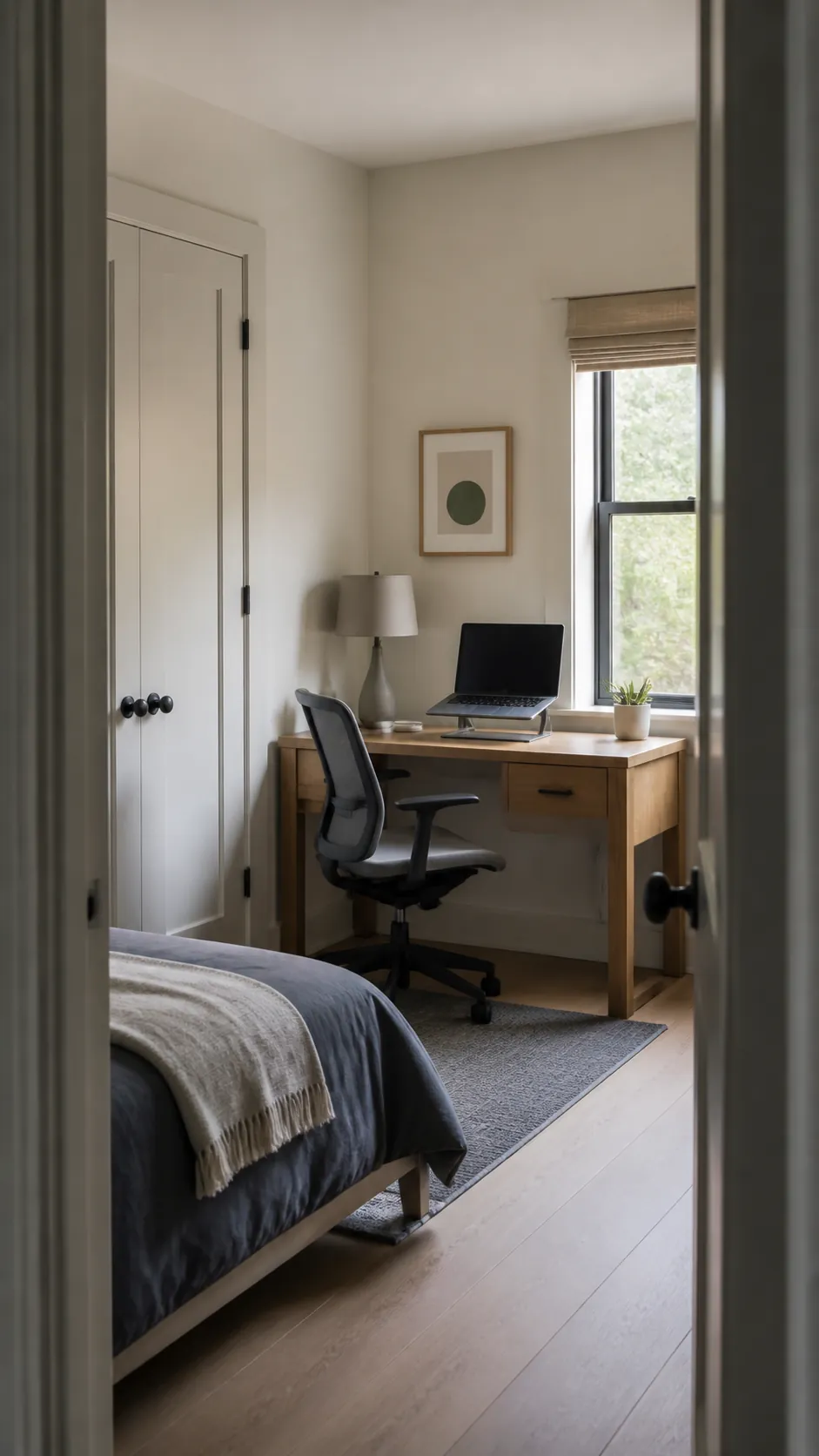 Calm corner office with an oak desk integrated into a small bedroom