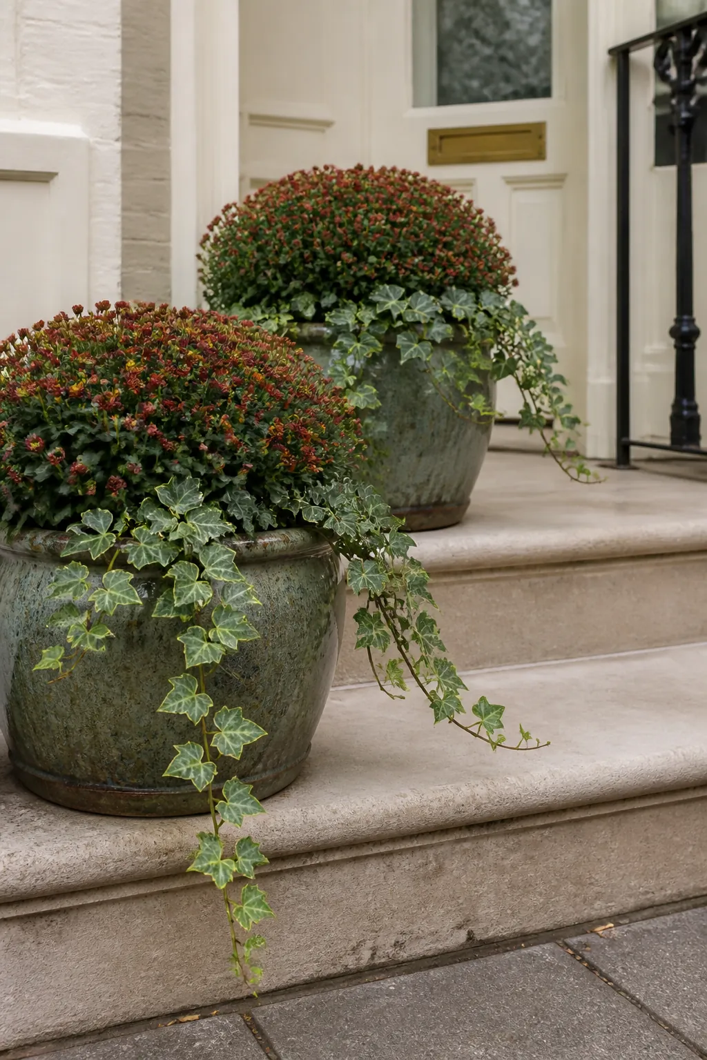 Autumn mums and trailing ivy filling porch planters