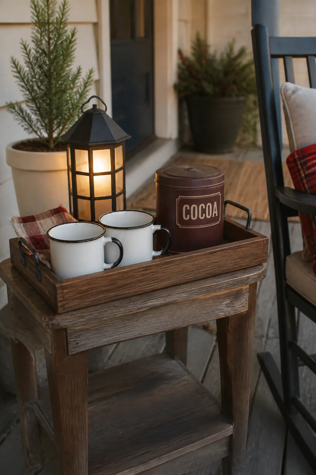 Weather ready cocoa station with enamel mugs on a sheltered porch