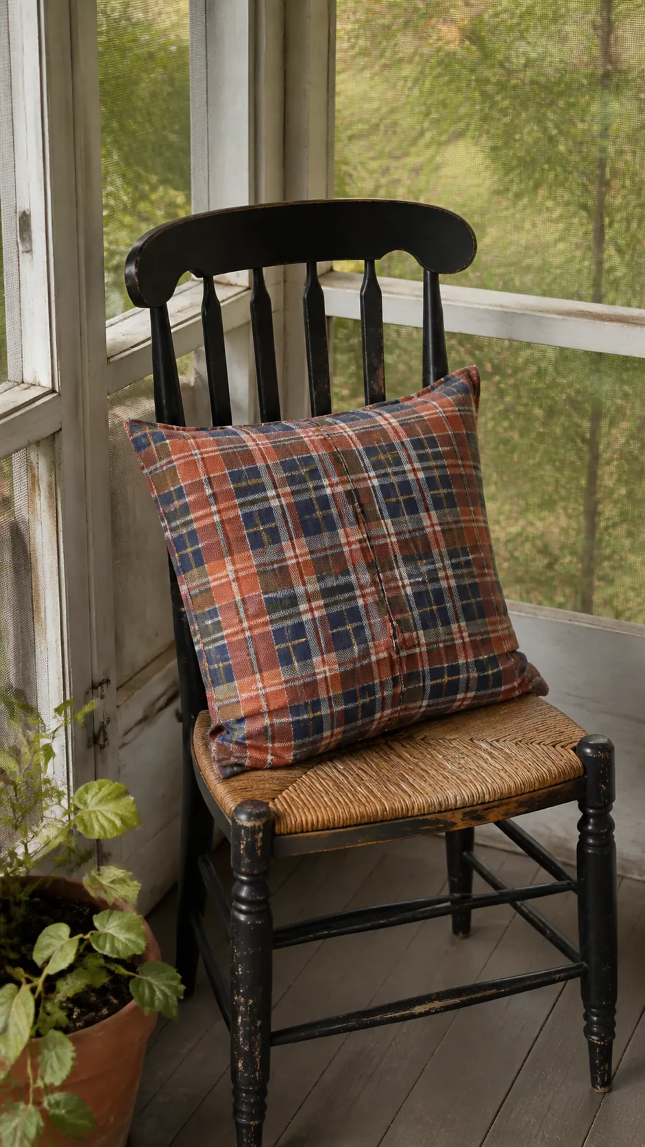 Plaid fabric remnant sewn into an autumn porch pillow cover