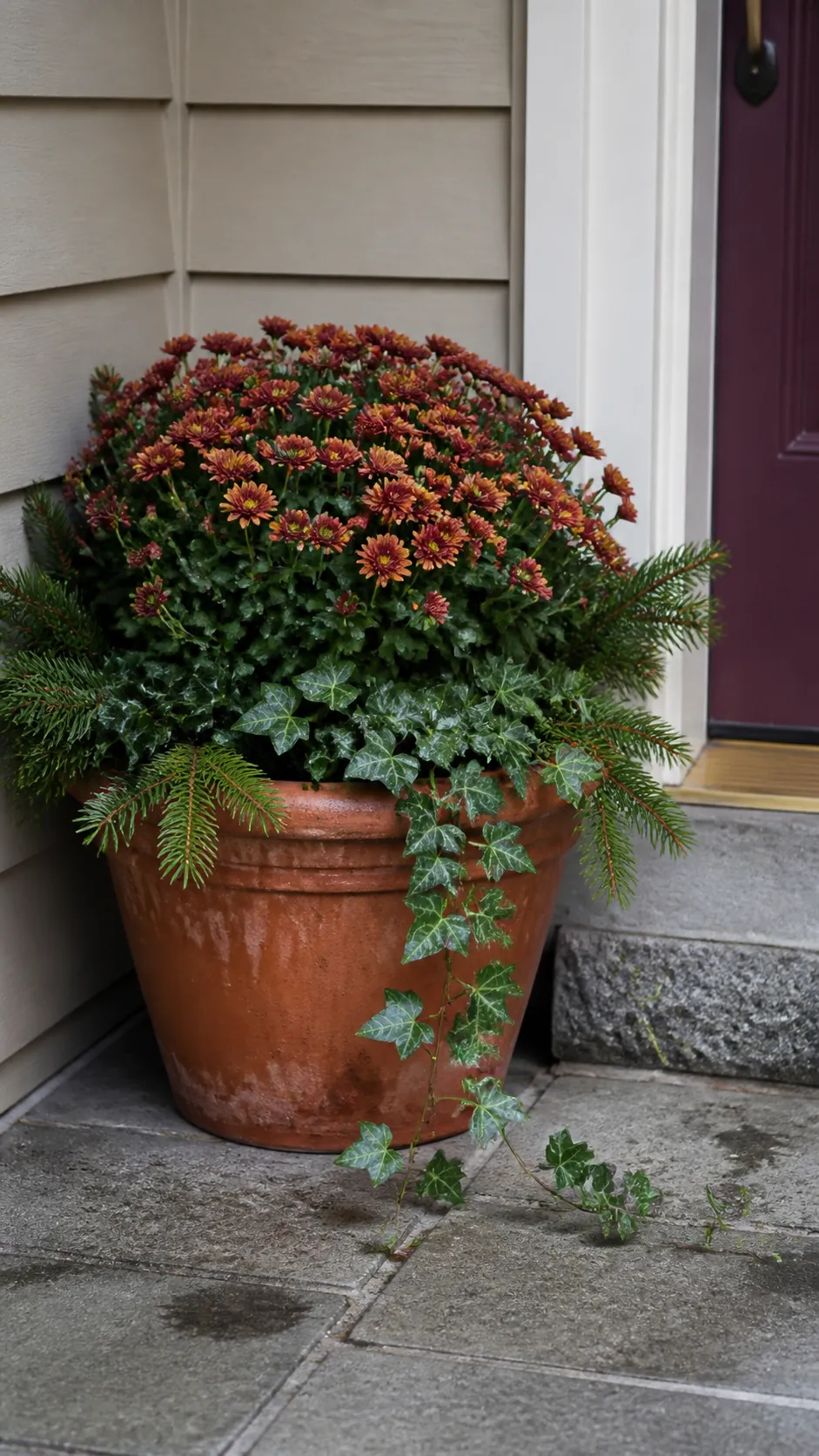 Single autumn mum made fuller with gathered greenery