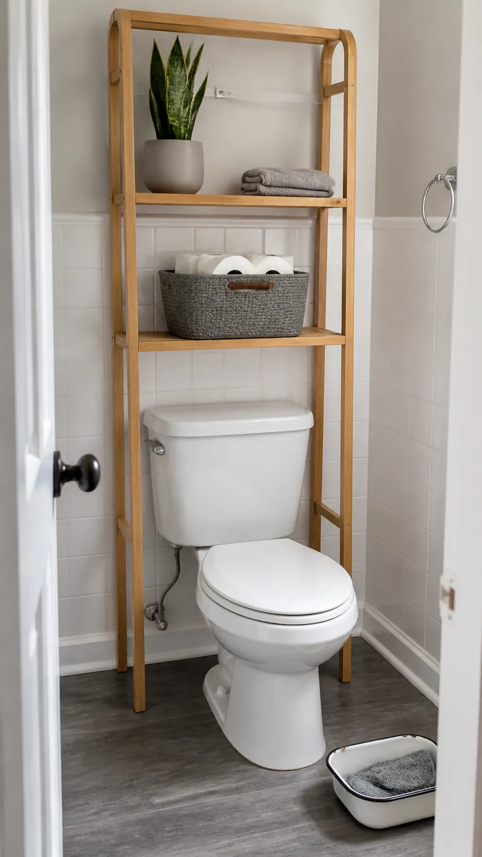 Easy clean over toilet shelf with minimal movable decor and a clear tank top
