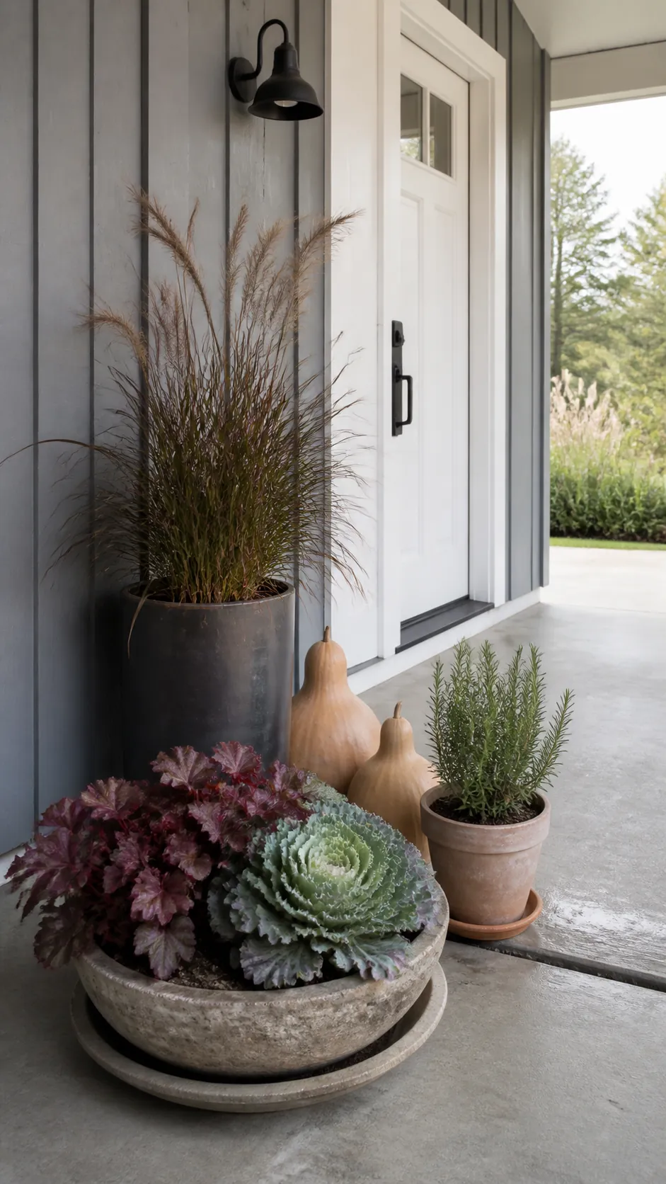 Fall porch planters with ornamental grass, heuchera, cabbage, and evergreen herbs