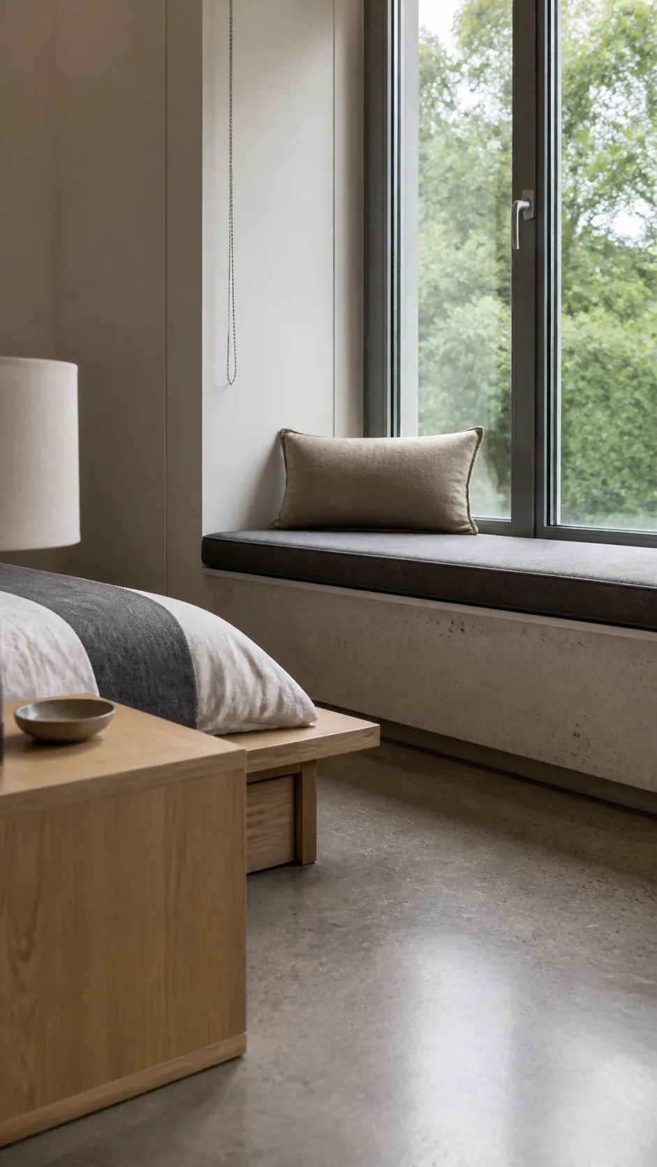Minimal Concrete Ledge in a practical bedroom window seat design