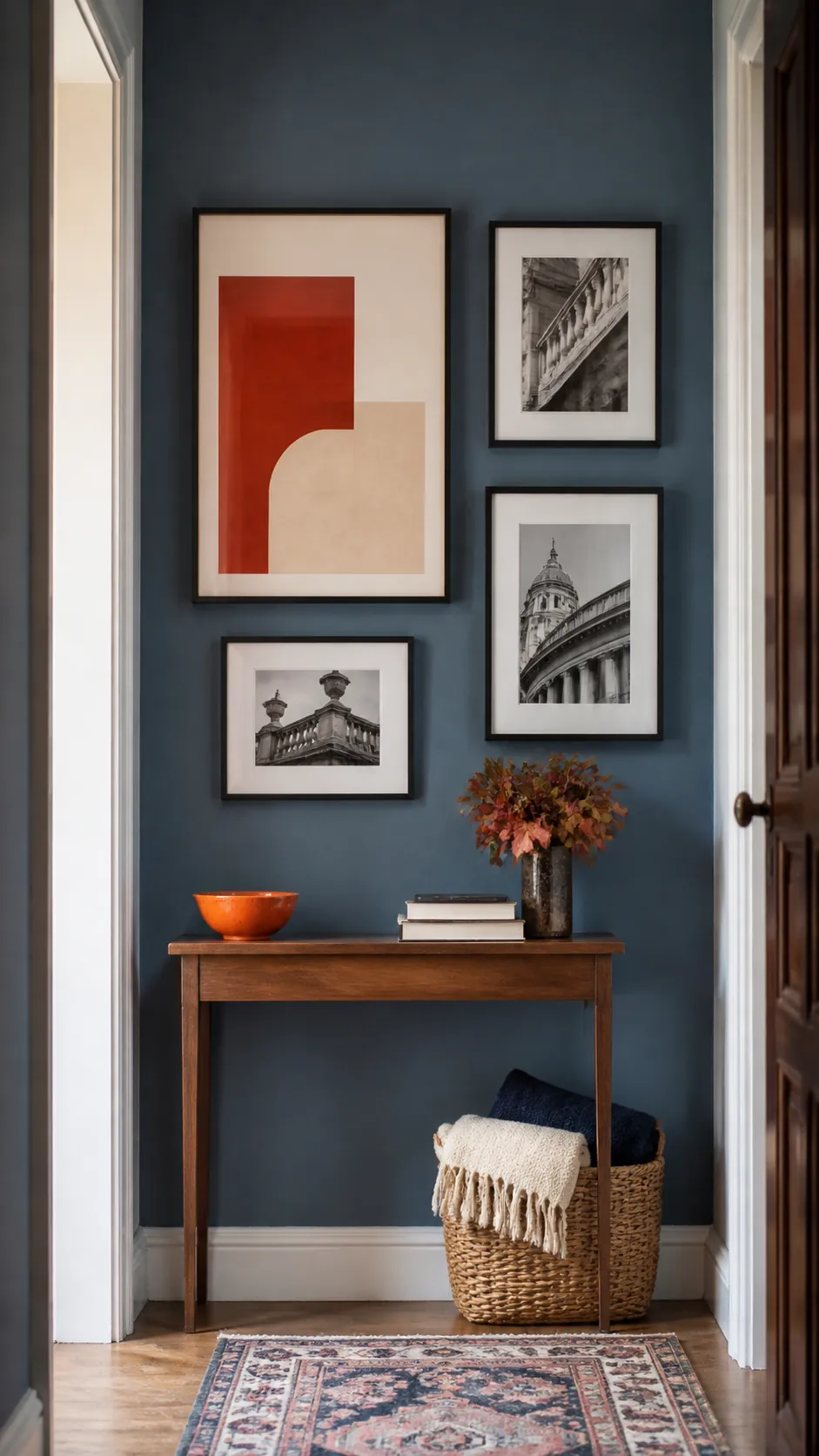 Blue gallery wall with a rust and cream color block print