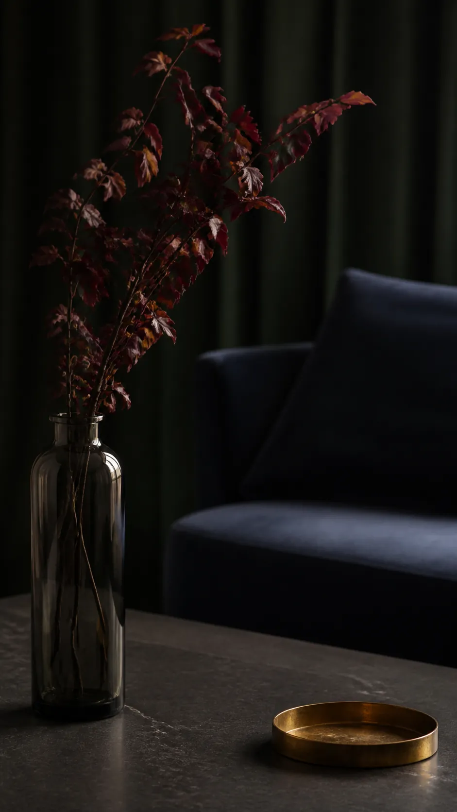Smoked glass vase with burgundy autumn foliage