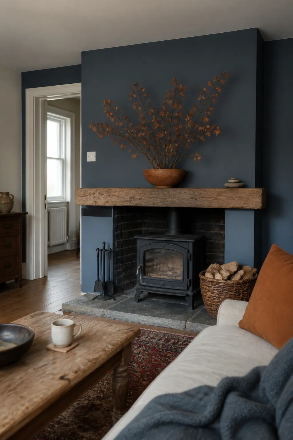 Blue Fireplace Wall With Copper Branches styled for a blue and orange fall living room