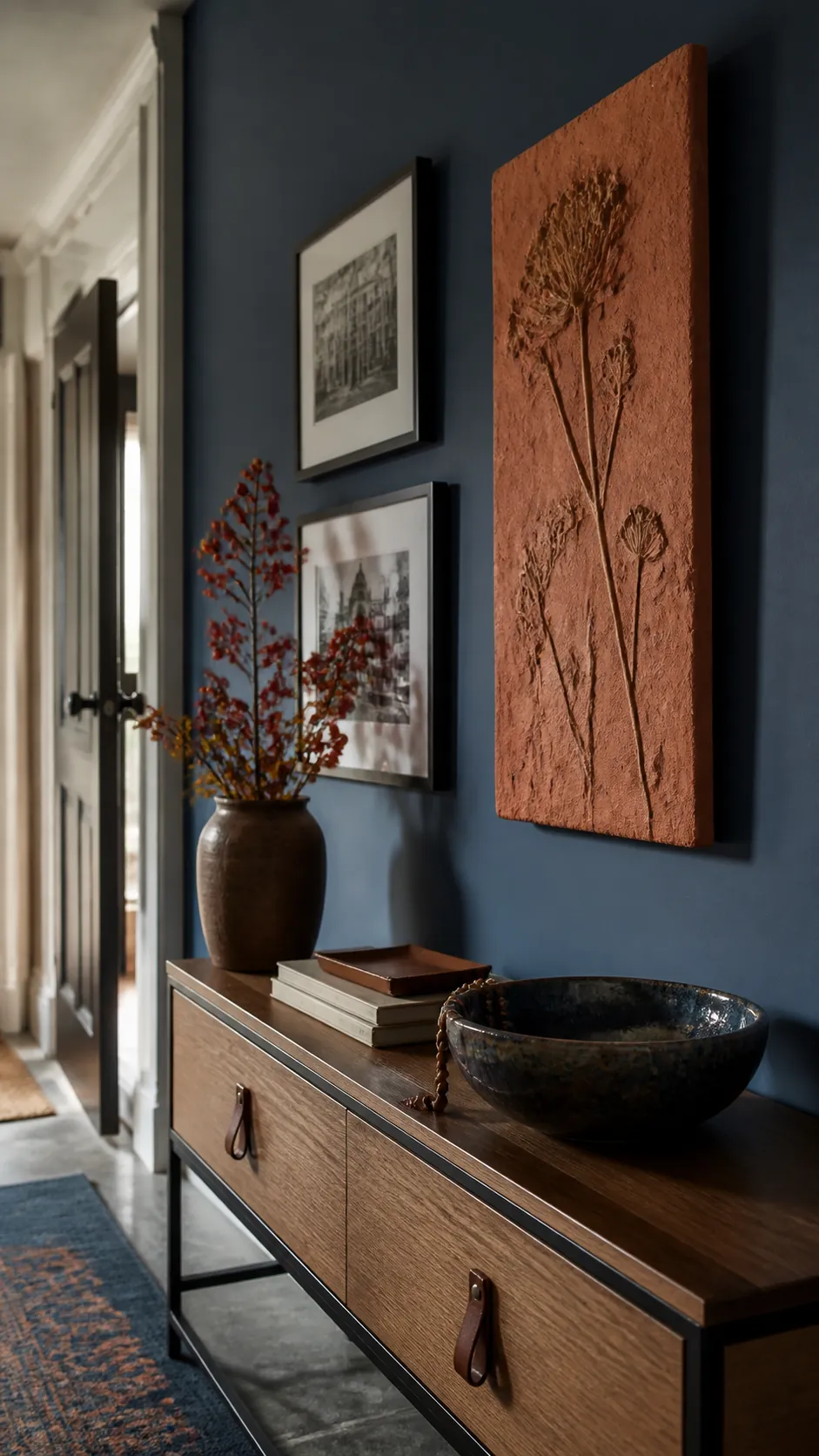 Blue Gallery Wall With Rust Relief arranged as navy blue and orange fall decor