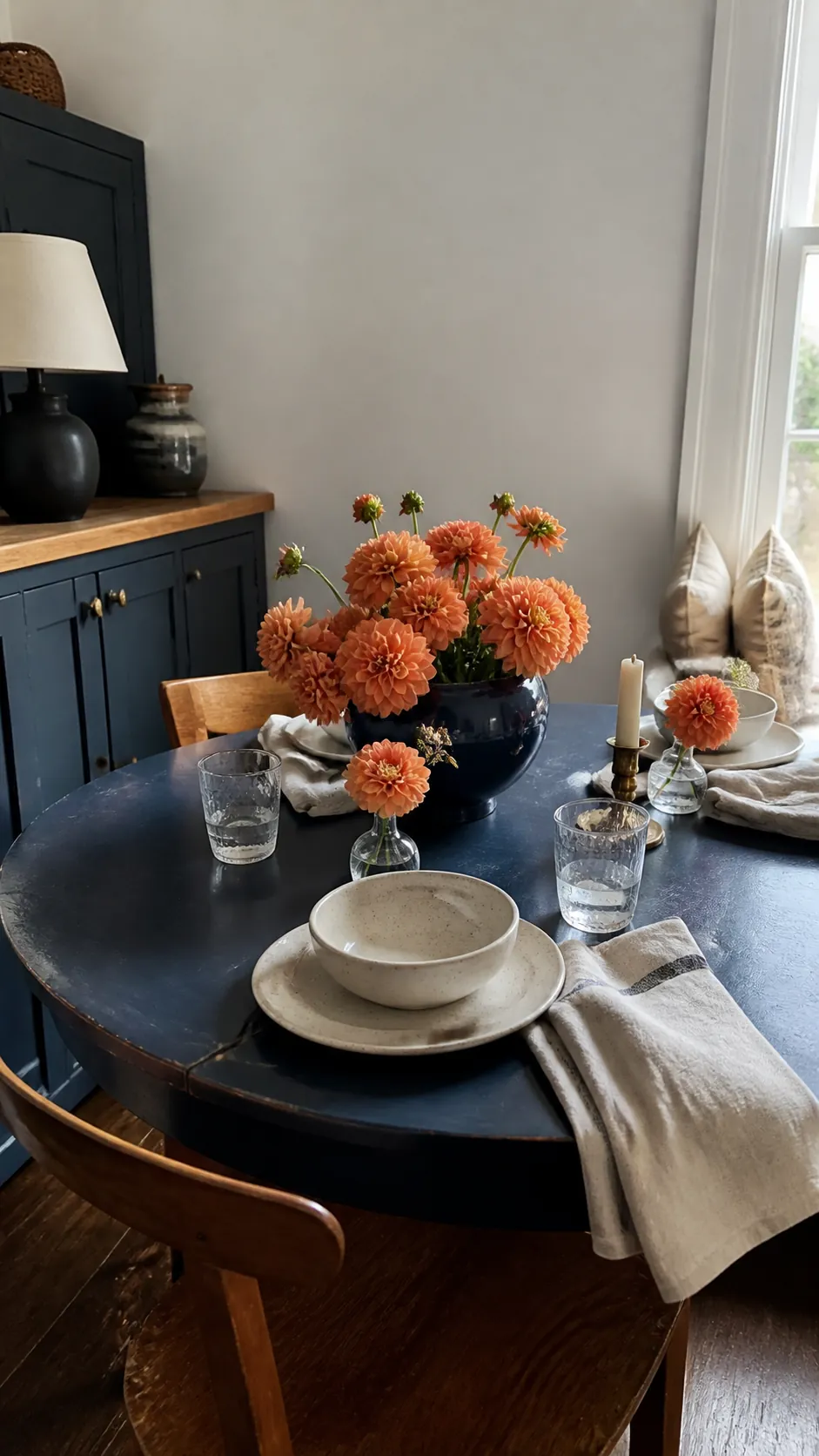 Navy Table With Orange Dahlias arranged as navy blue and orange fall decor