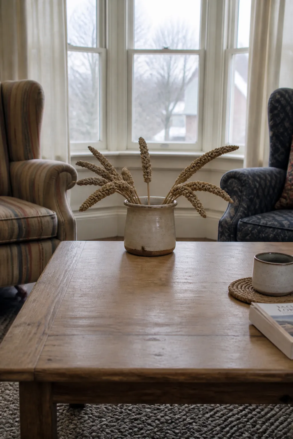 Short dried millet in a vintage crock for simple fall decor