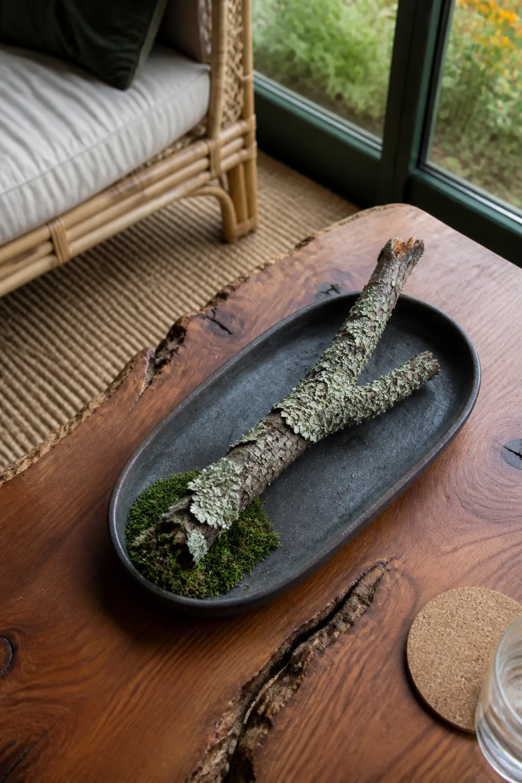 Weathered lichen branch in a mossy dish for natural fall decor