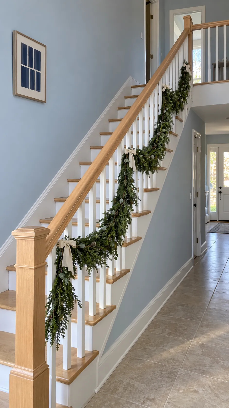 Christmas garland swags below an unobstructed handrail