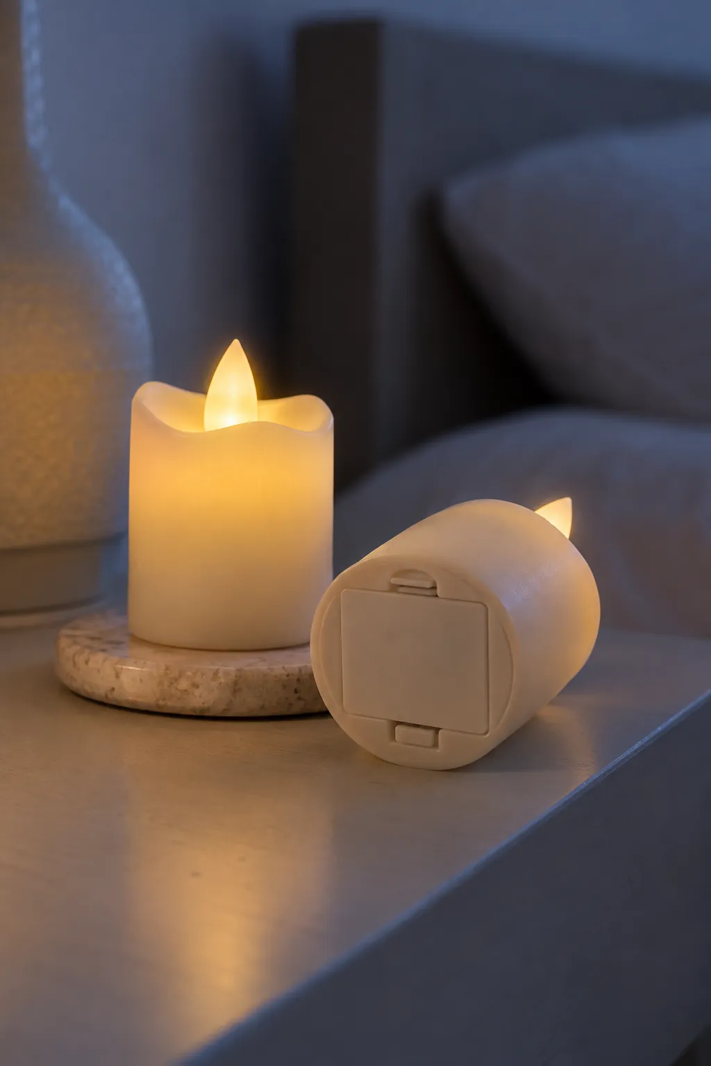A pair of small battery candles in a small apartment Christmas display