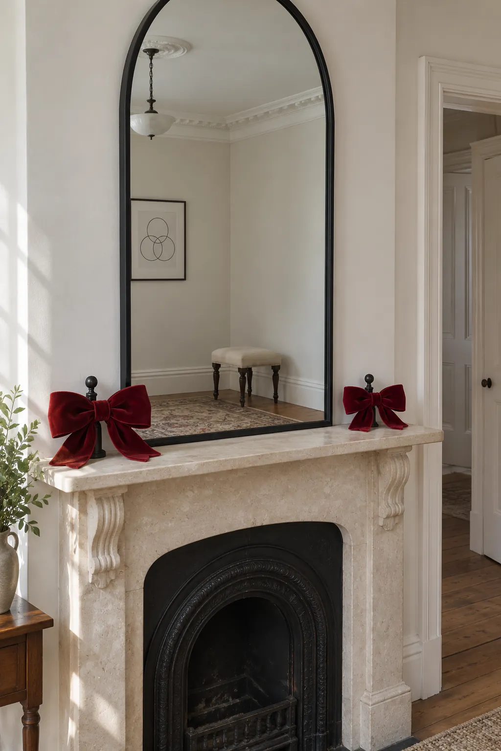 Ribbon Bows at the Ends Christmas mantel arrangement beneath a large mirror