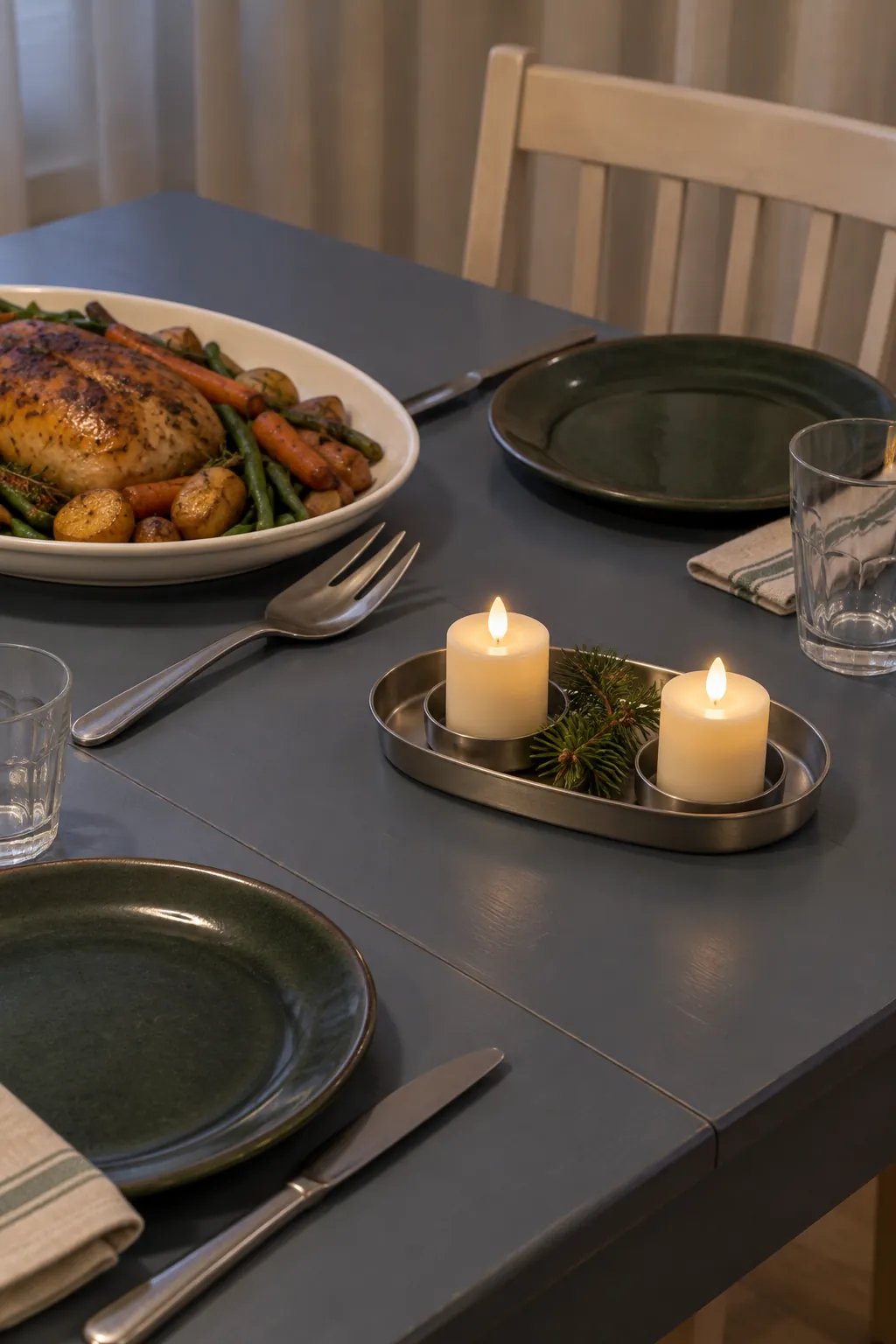 Two short battery candles in a compact tray with a clear serving area beside them