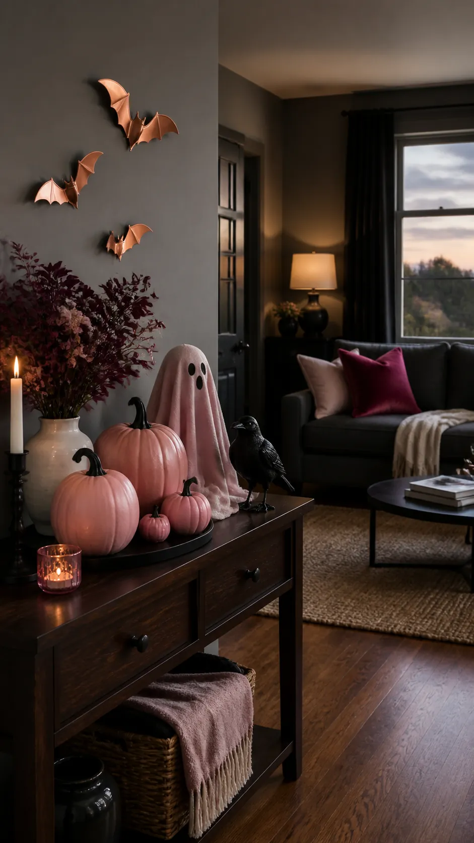 Pink Halloween decor in a stylish living room with pumpkins and ghosts