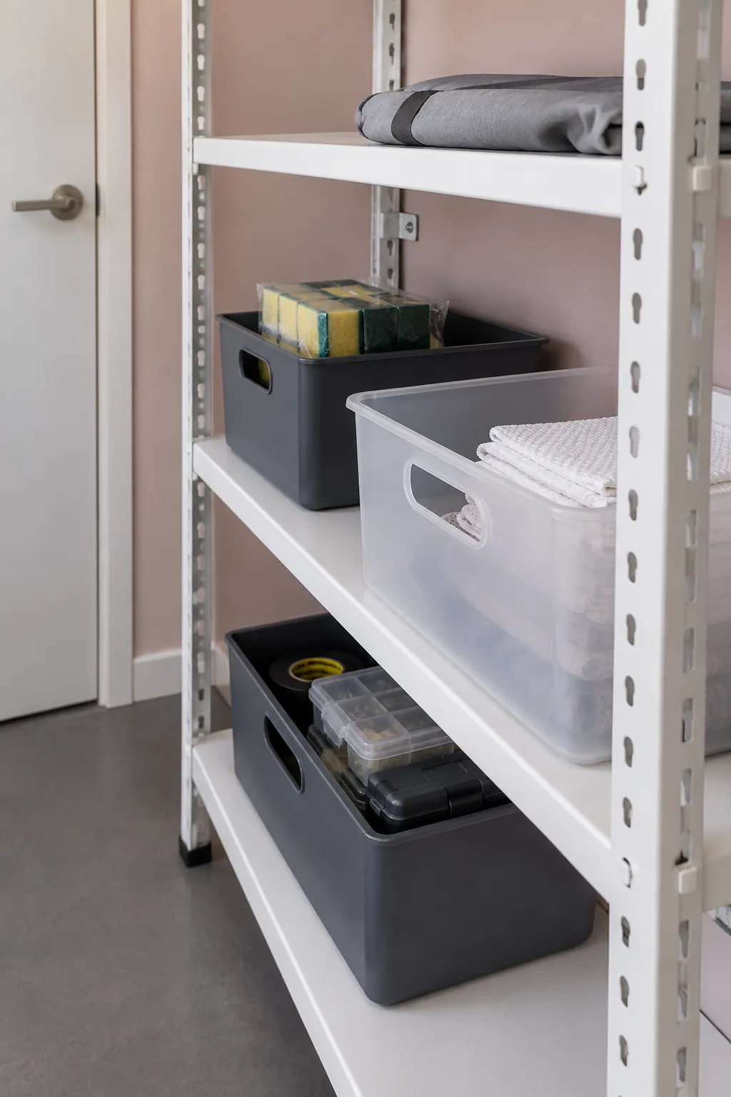 Shallow utility storage bins with reachable handles and spare shelf space