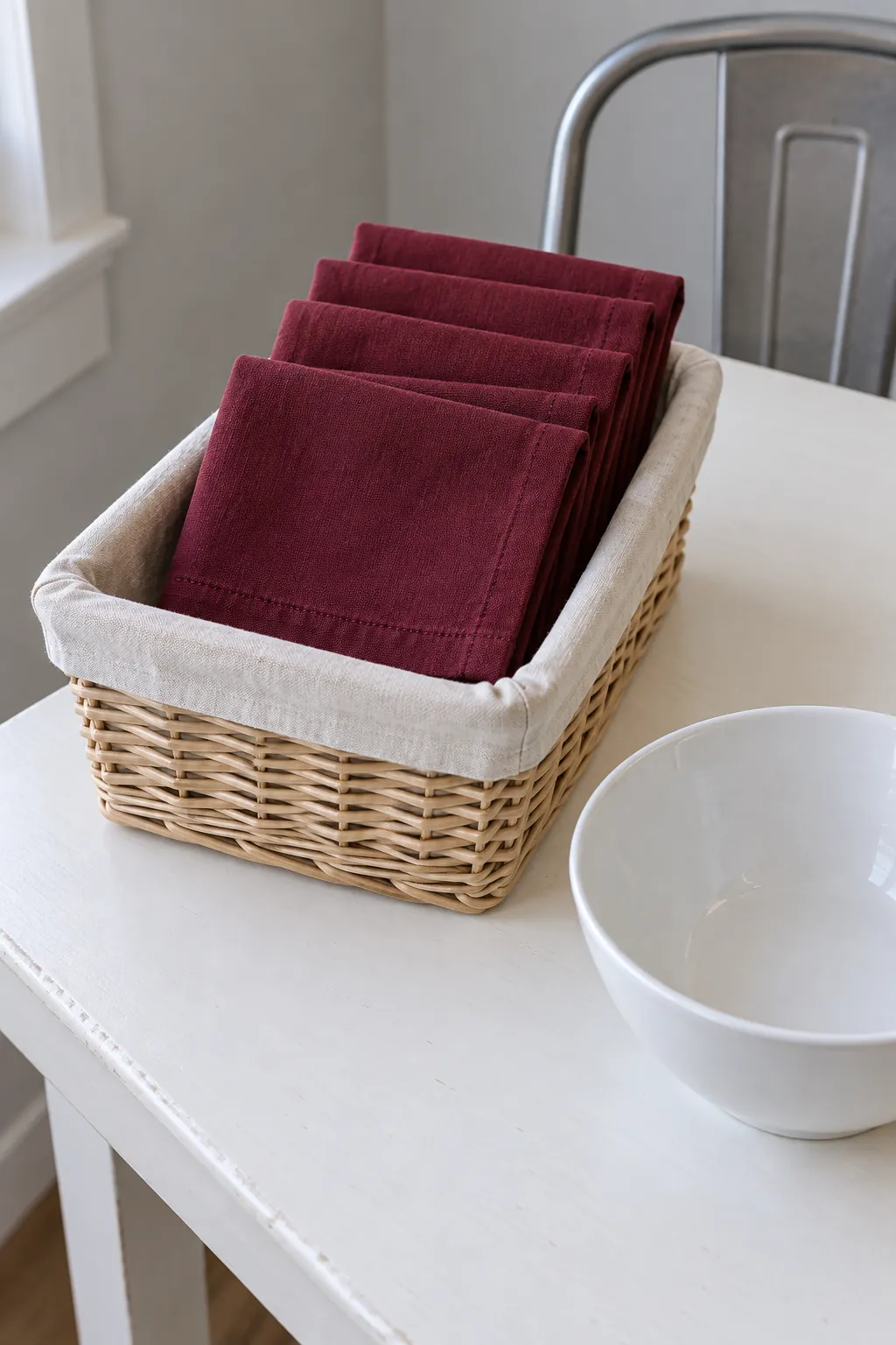Burgundy napkins in a breakfast basket for practical fall kitchen decor