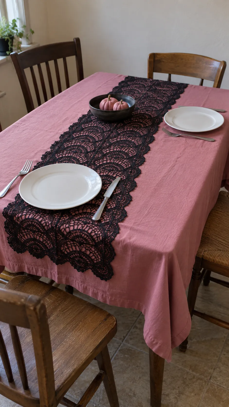 Black lace over a pink tablecloth in black and pink Halloween decor