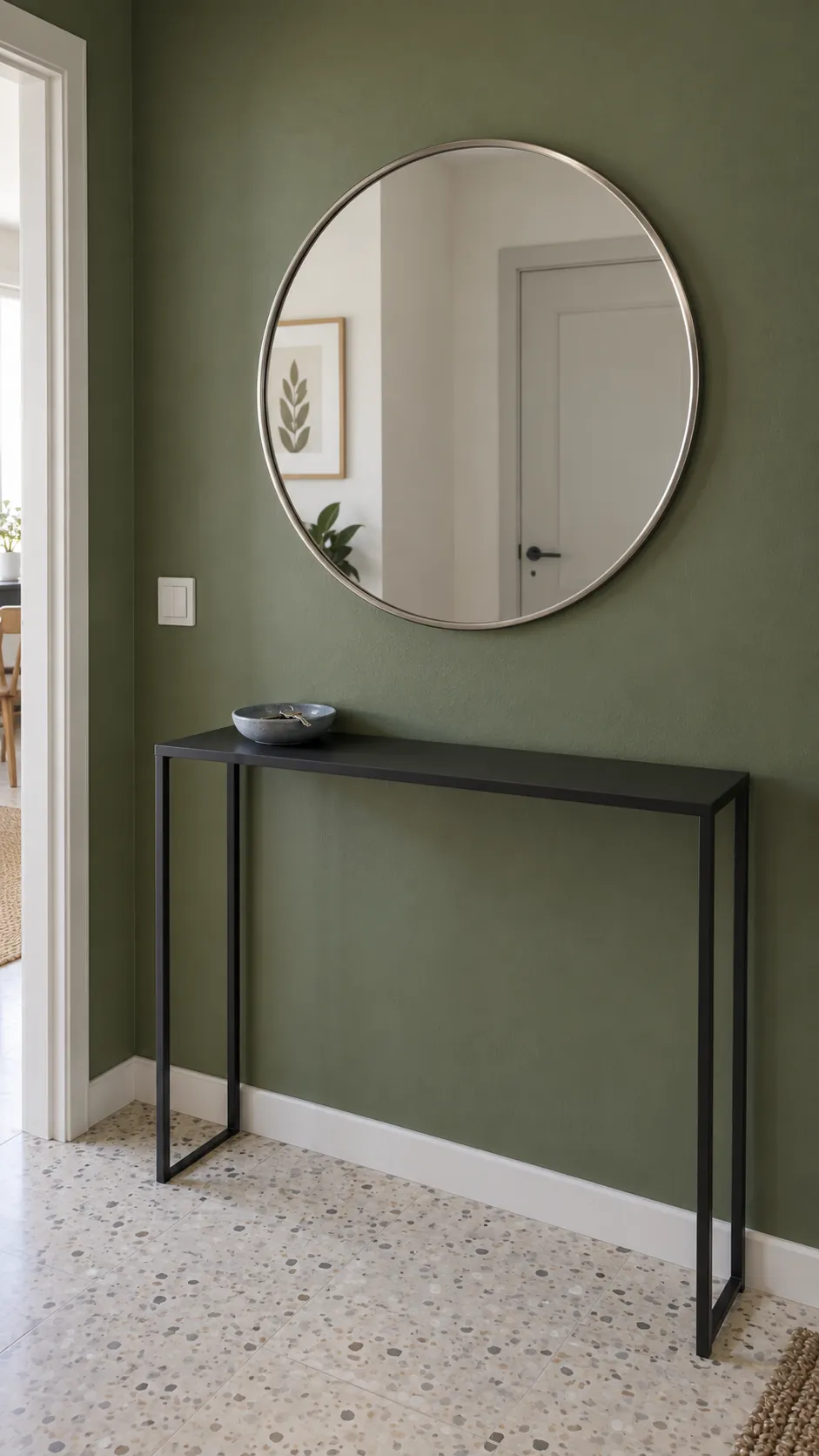 A Round Mirror Against Moss Green