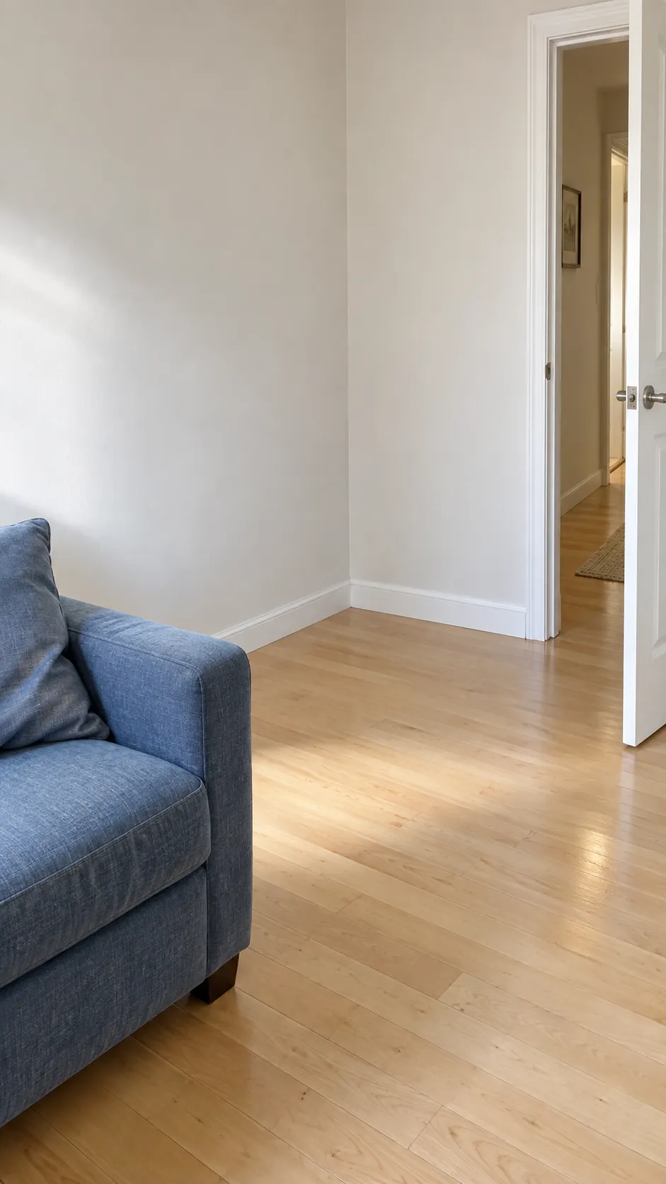 A cleared apartment corner beside a passage