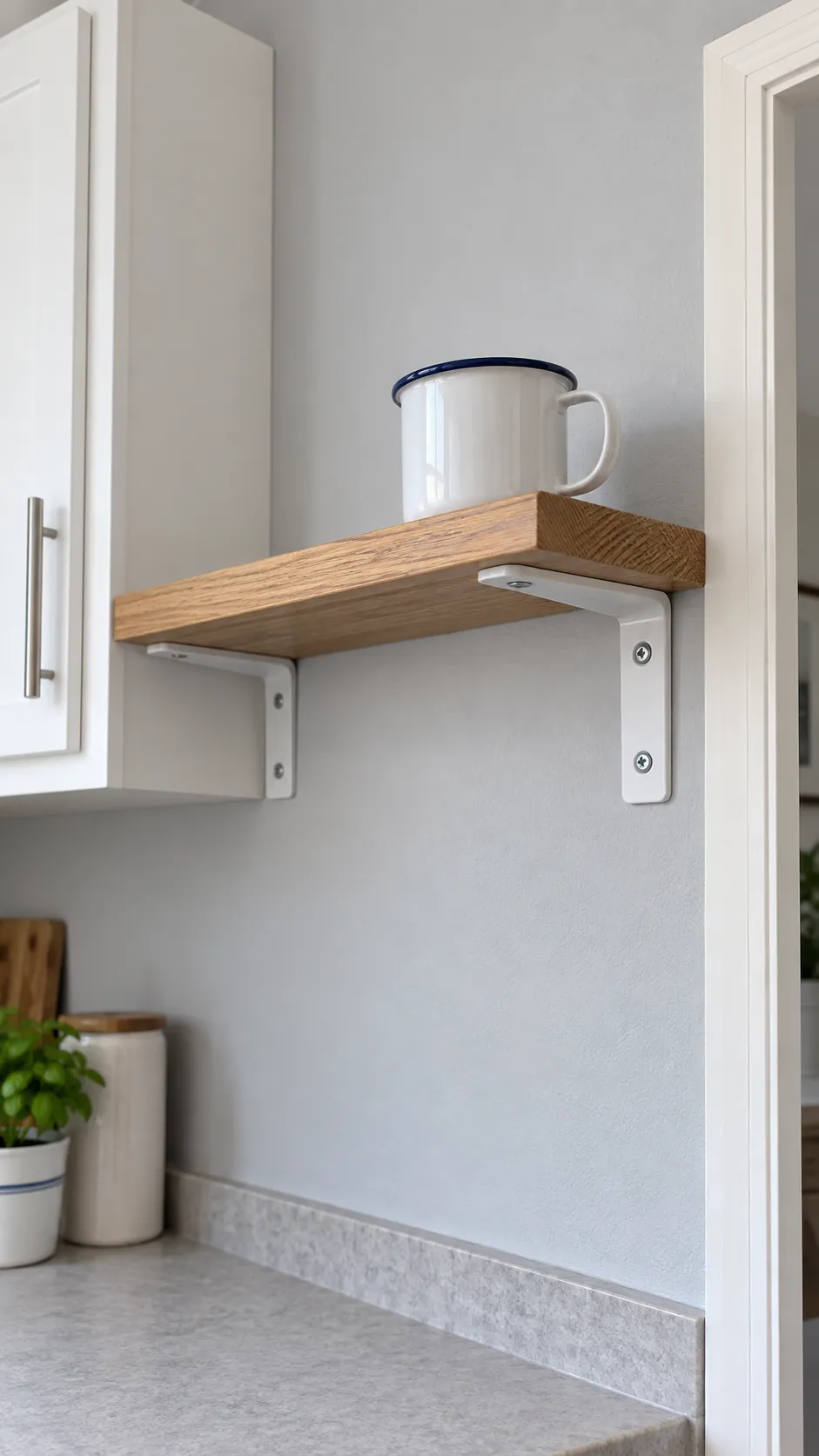 A shallow oak shelf with sturdy visible brackets