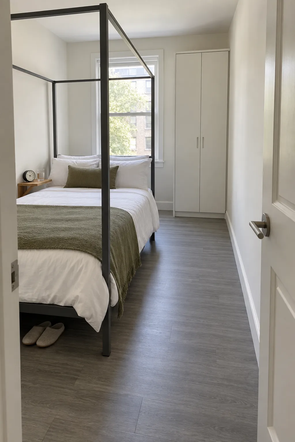 A narrow canopy in a room with one clear aisle in a practical canopy bedroom