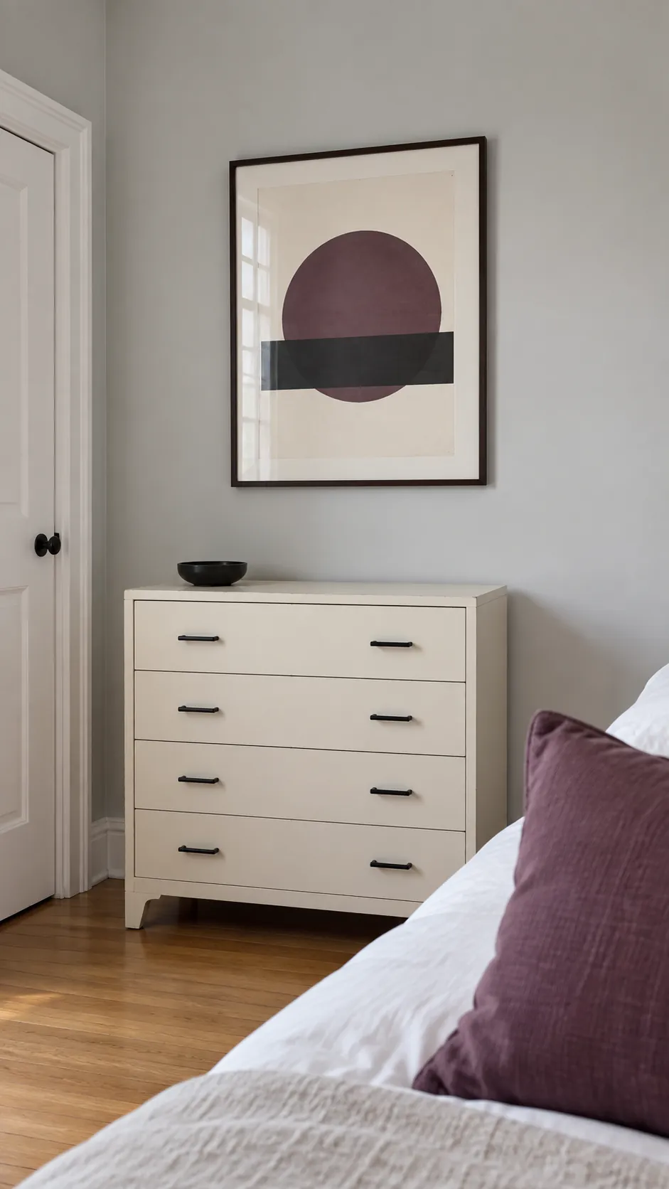 Plum geometric print coordinating with a cushion and black hardware
