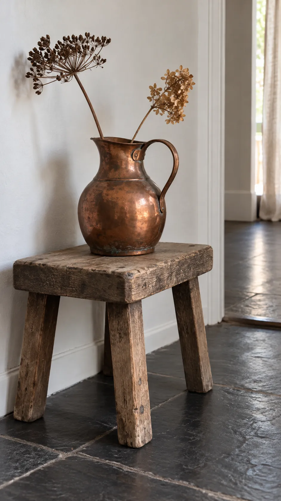 A copper accent beside weathered timber for coastal fall decor