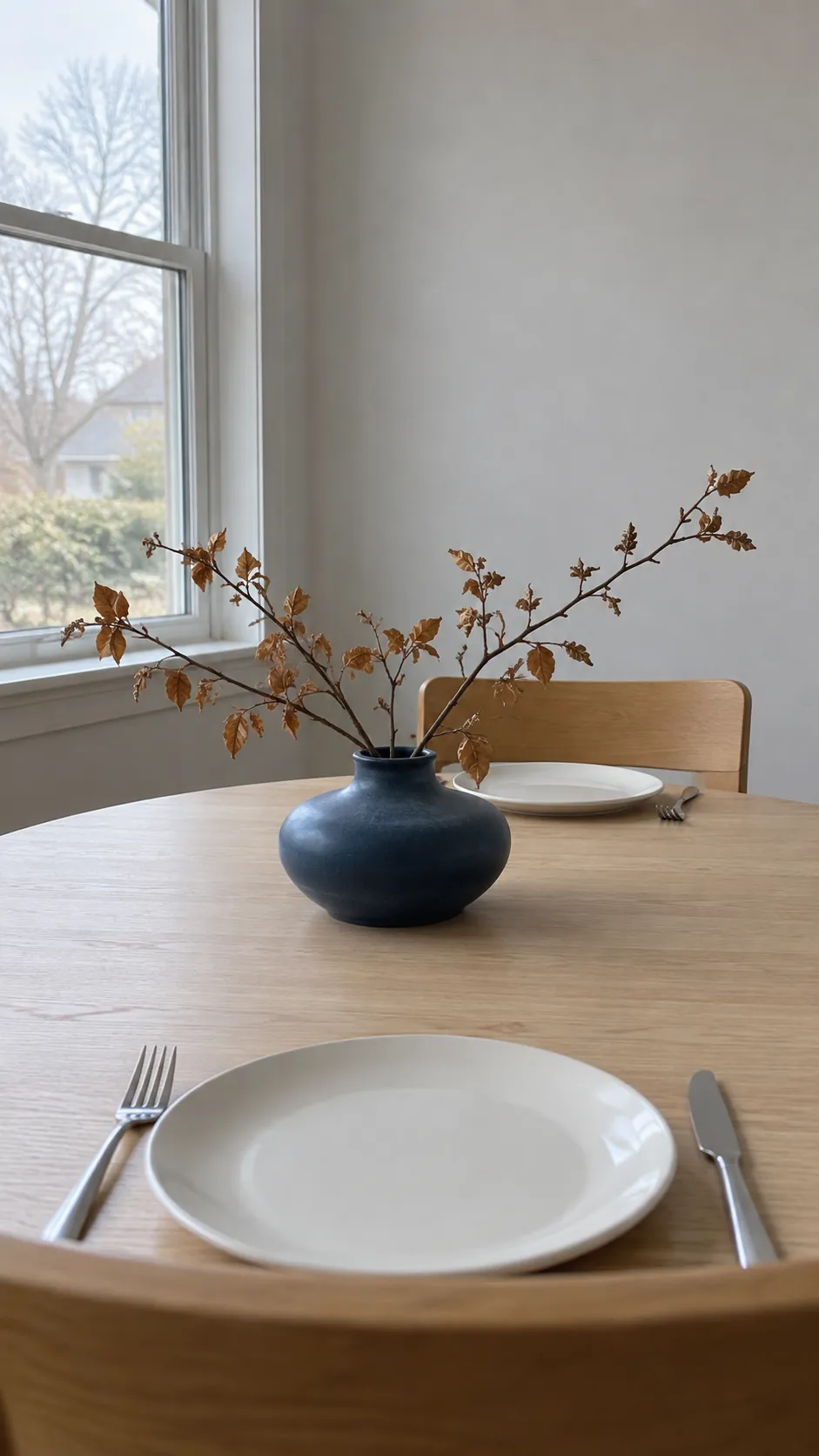 A low arrangement of clipped branches for coastal fall decor