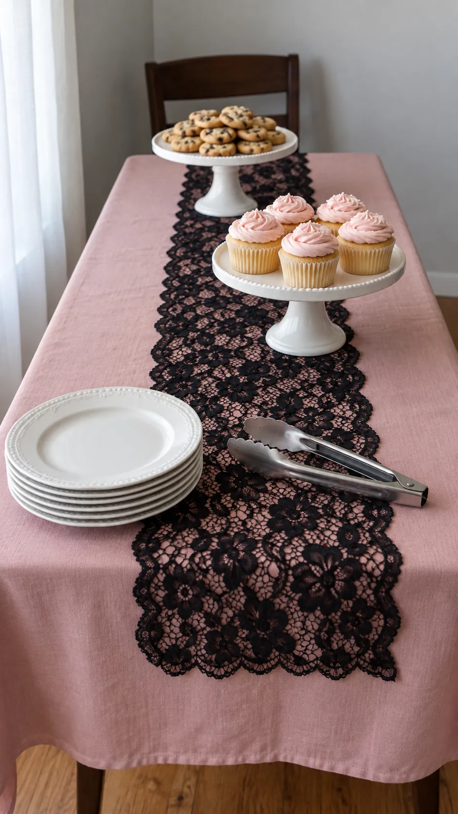A lace runner on a plain dessert table for a pink Halloween birthday party