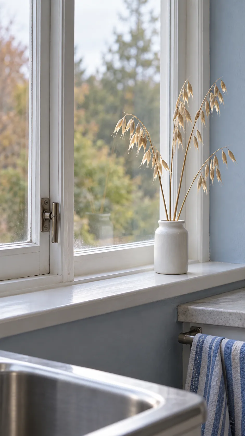 Use the window for a small change in texture in a blue and white fall kitchen