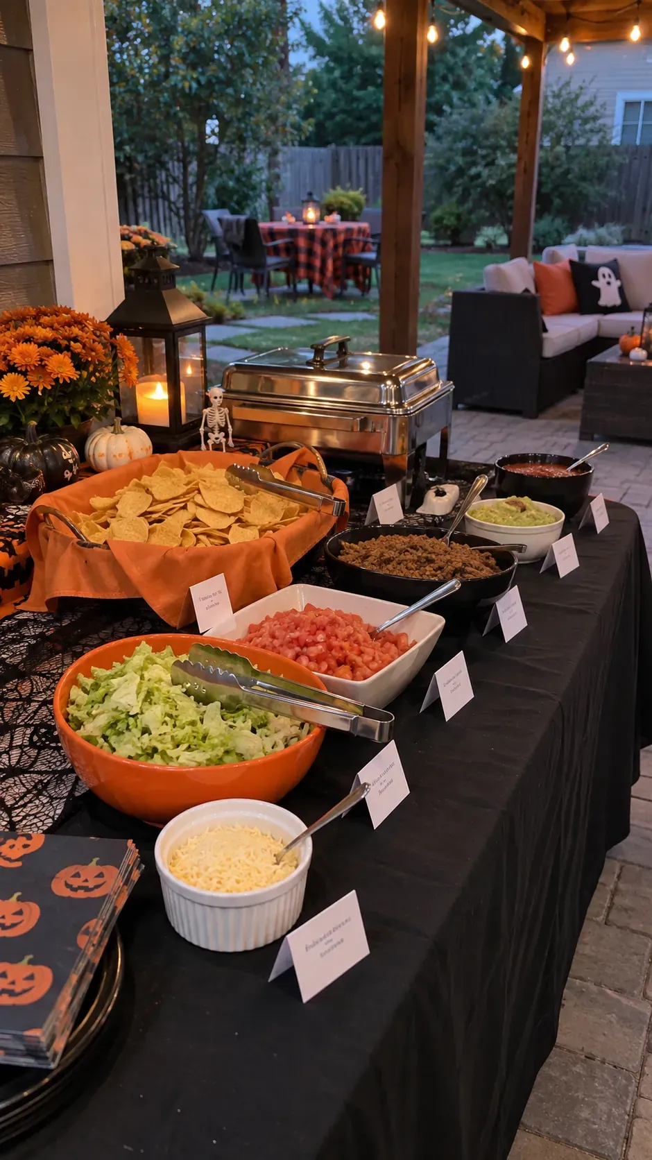 Backyard Halloween party clear food labels setup