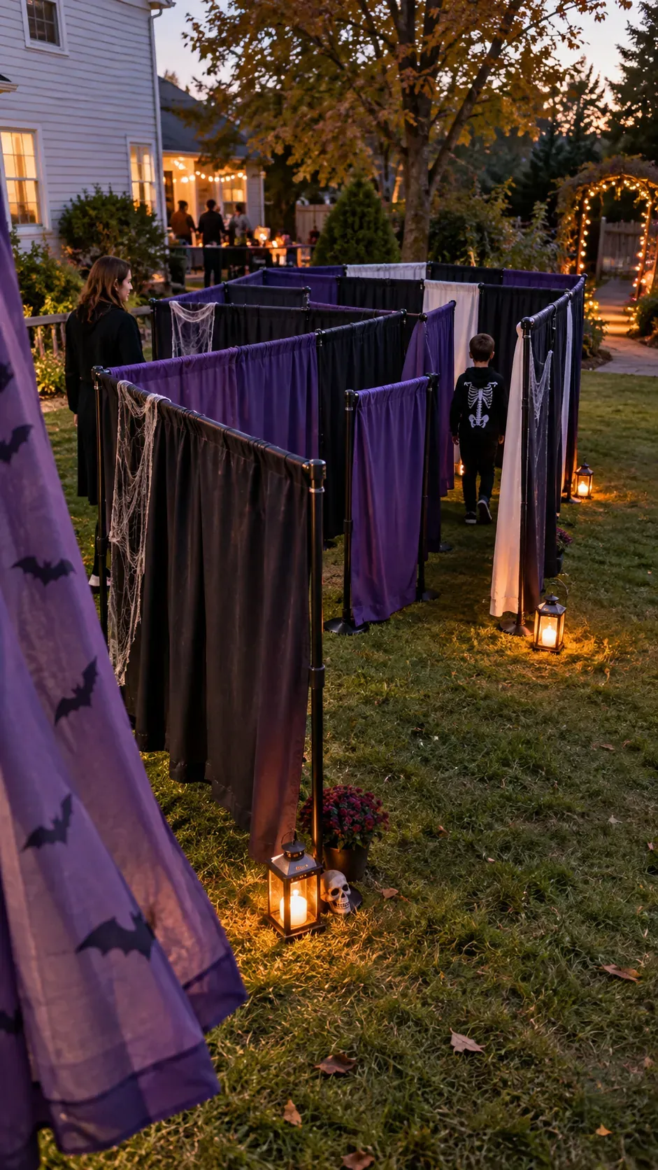 Backyard Halloween party curtain maze setup