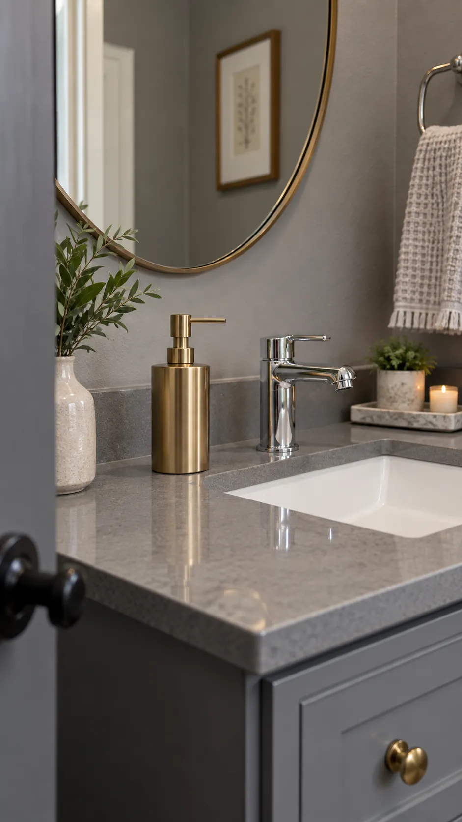 use a restrained warm metal accent in a gray powder room