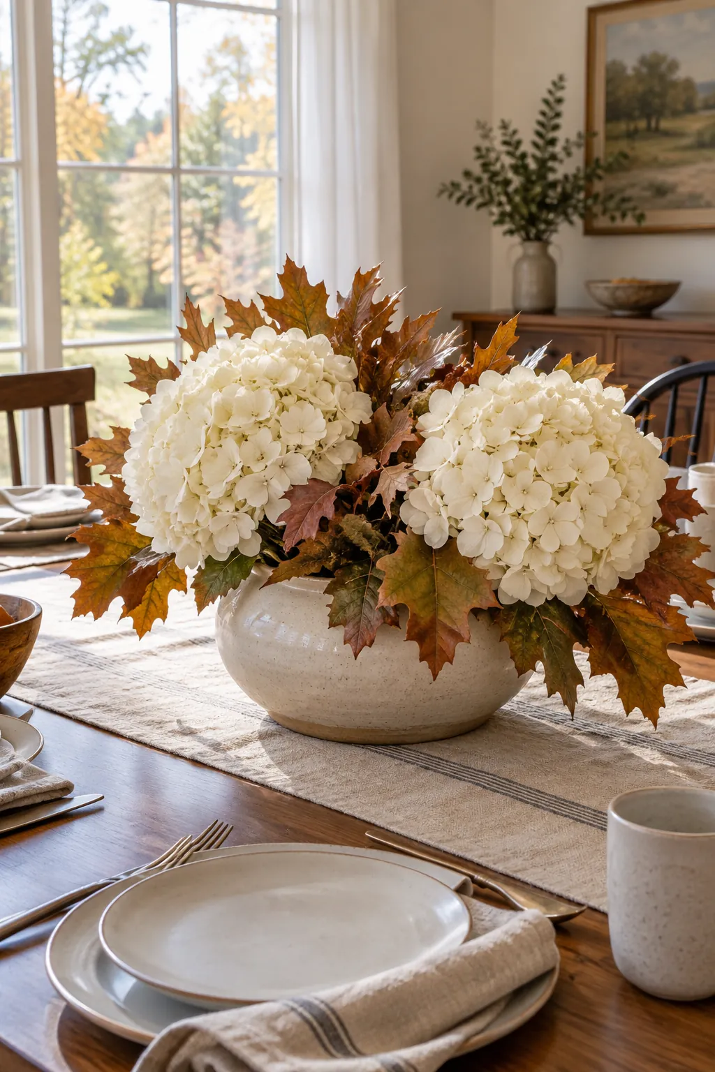Ivory Hydrangeas with Oak Leaves as a fall flower centerpiece for Thanksgiving