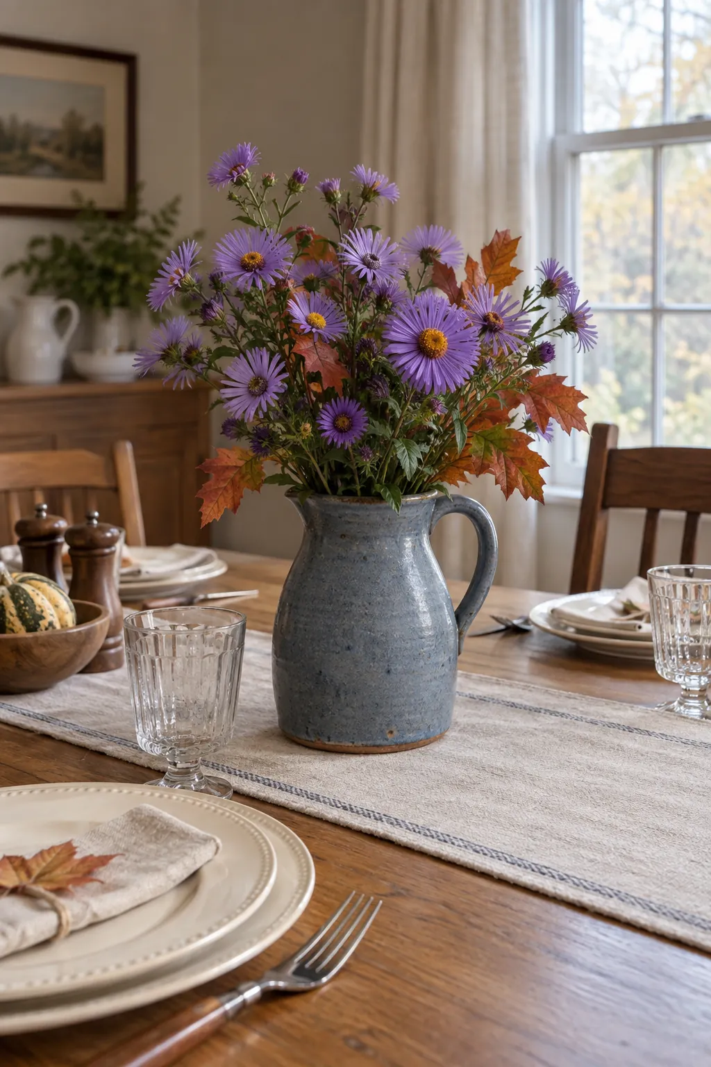 Autumn Asters in a Blue Stoneware Jug as a fall flower centerpiece for Thanksgiving