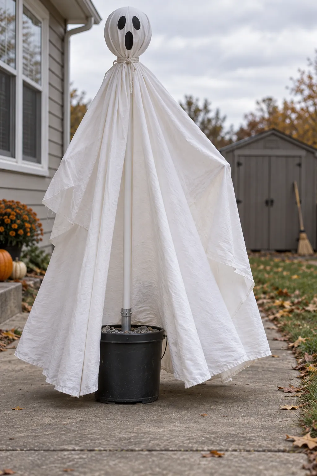 Gravel Bucket Ghost as a DIY outdoor Halloween ghost display without a tree