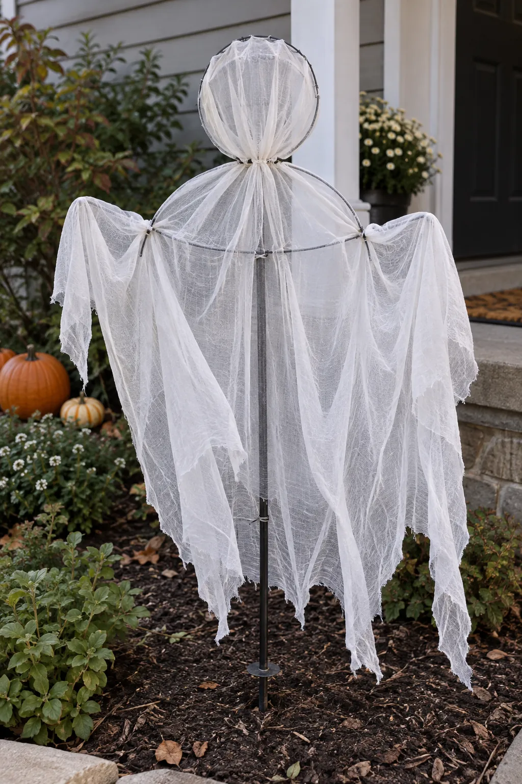 Wire Wreath Frame Ghost as a DIY outdoor Halloween ghost display without a tree
