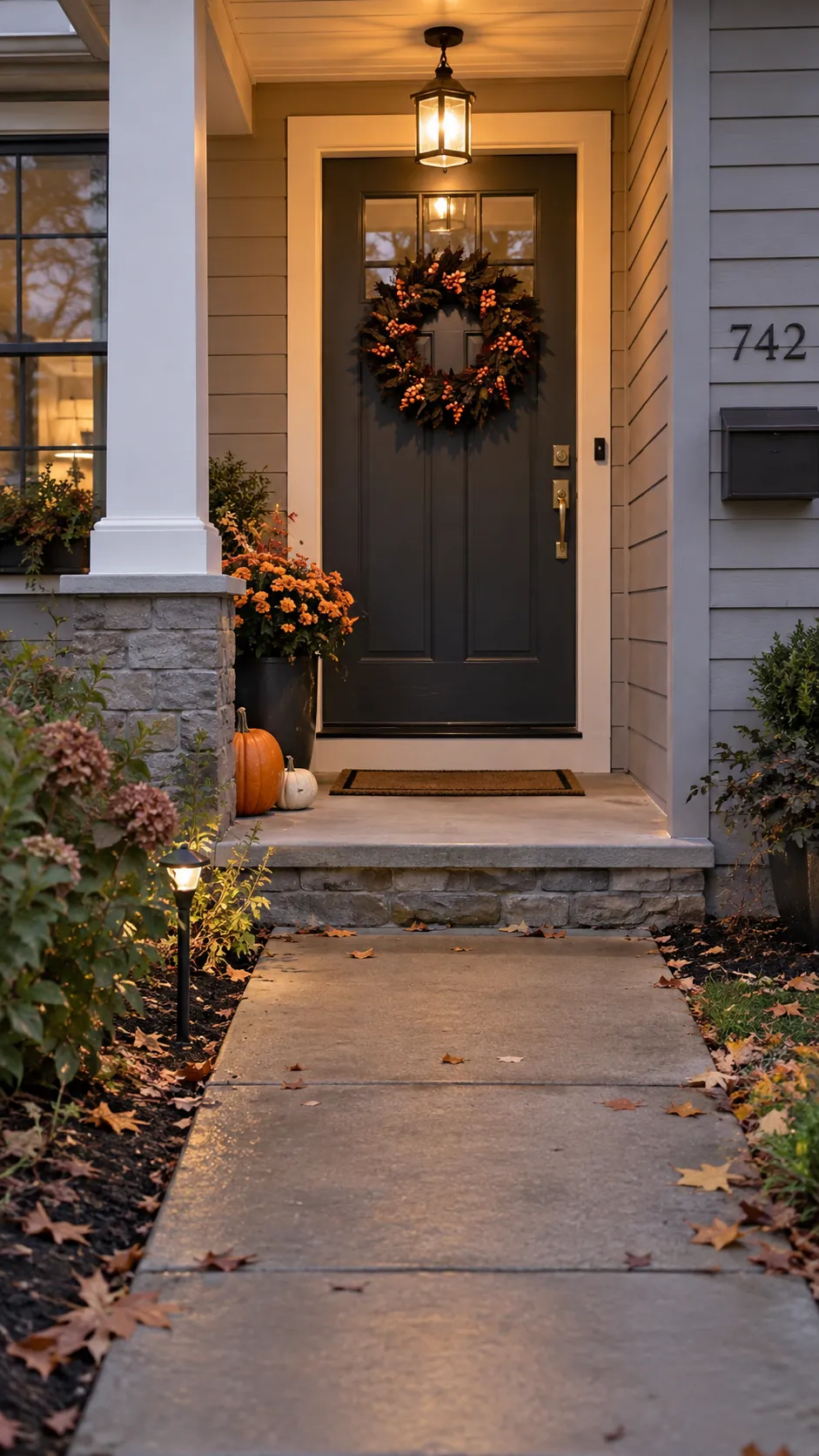 Make the front door the main focal point in a Halloween front yard with an open walkway