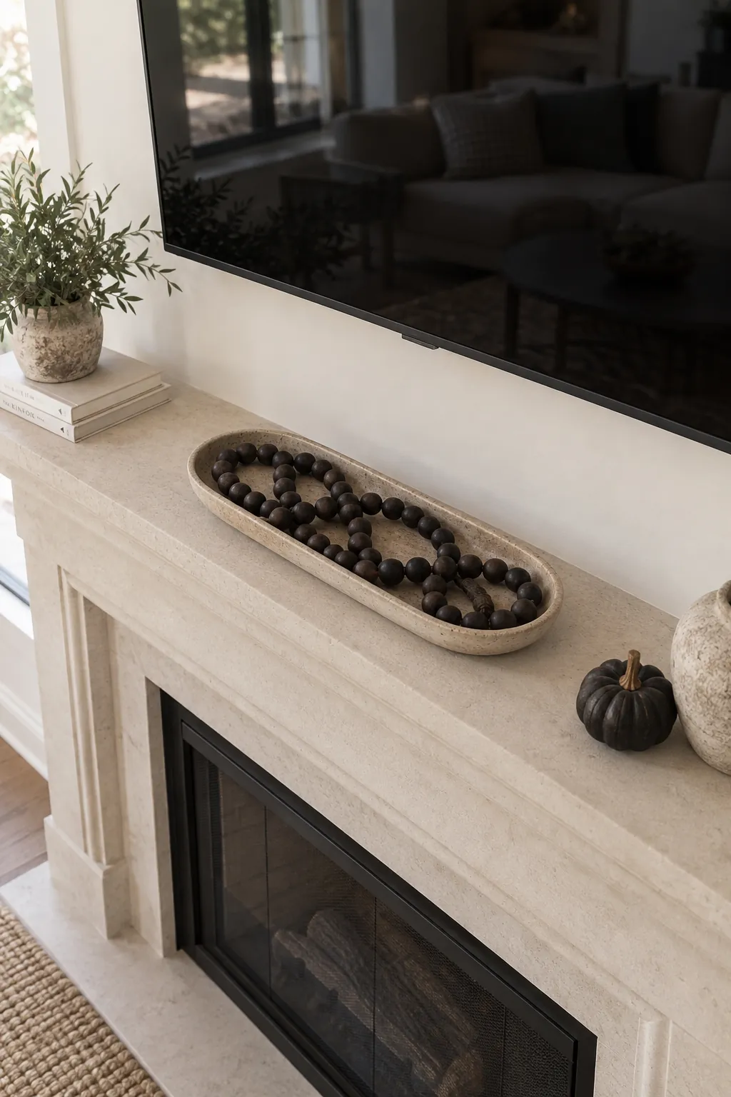 Dark wooden bead strand contained in a shallow mantel tray