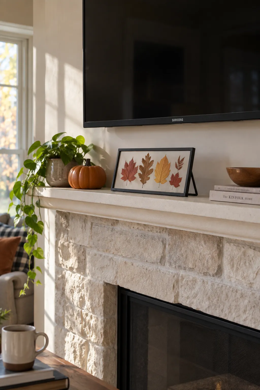 Horizontal frame of pressed leaves on a low Halloween mantel