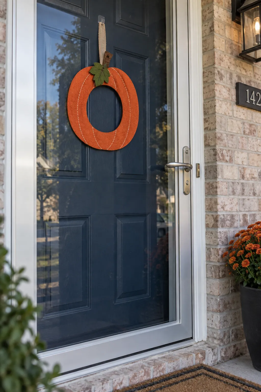 Flat Felt Pumpkin Wreath with a closing storm door