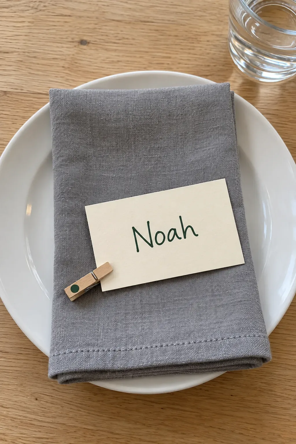 Handmade Thanksgiving name card clipped flat on a napkin