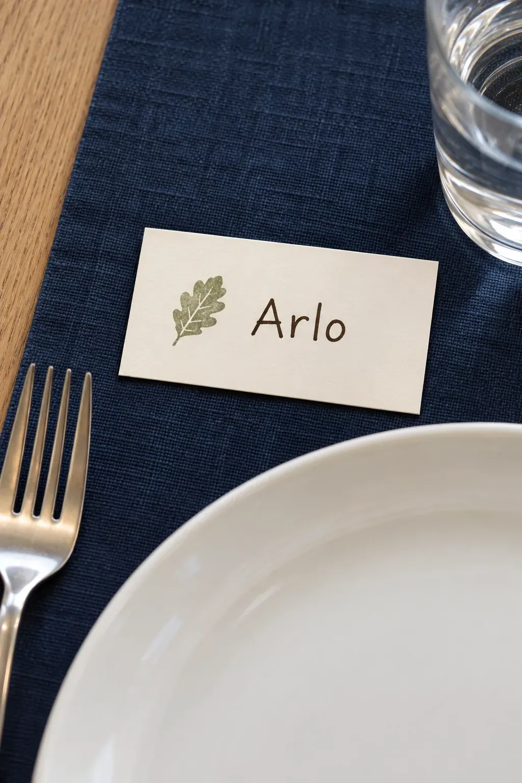 Handmade Thanksgiving place card with a stamped motif beside the name