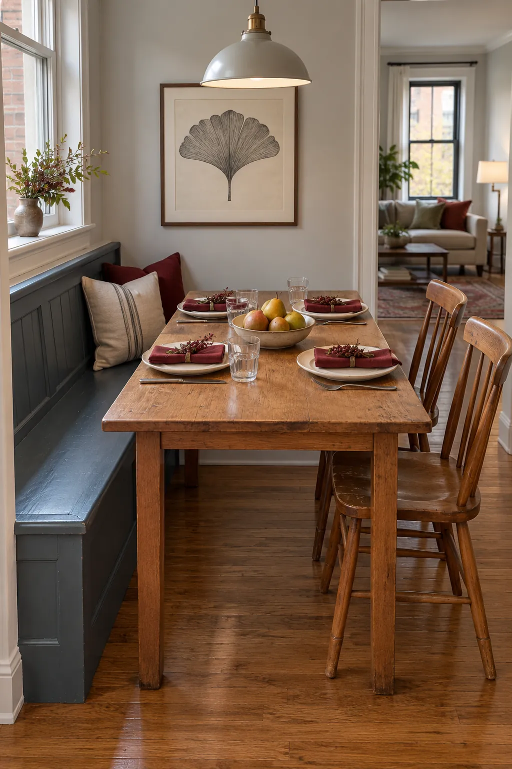 Compact Thanksgiving table with wall bench, loose chairs, and clear access in a narrow dining nook
