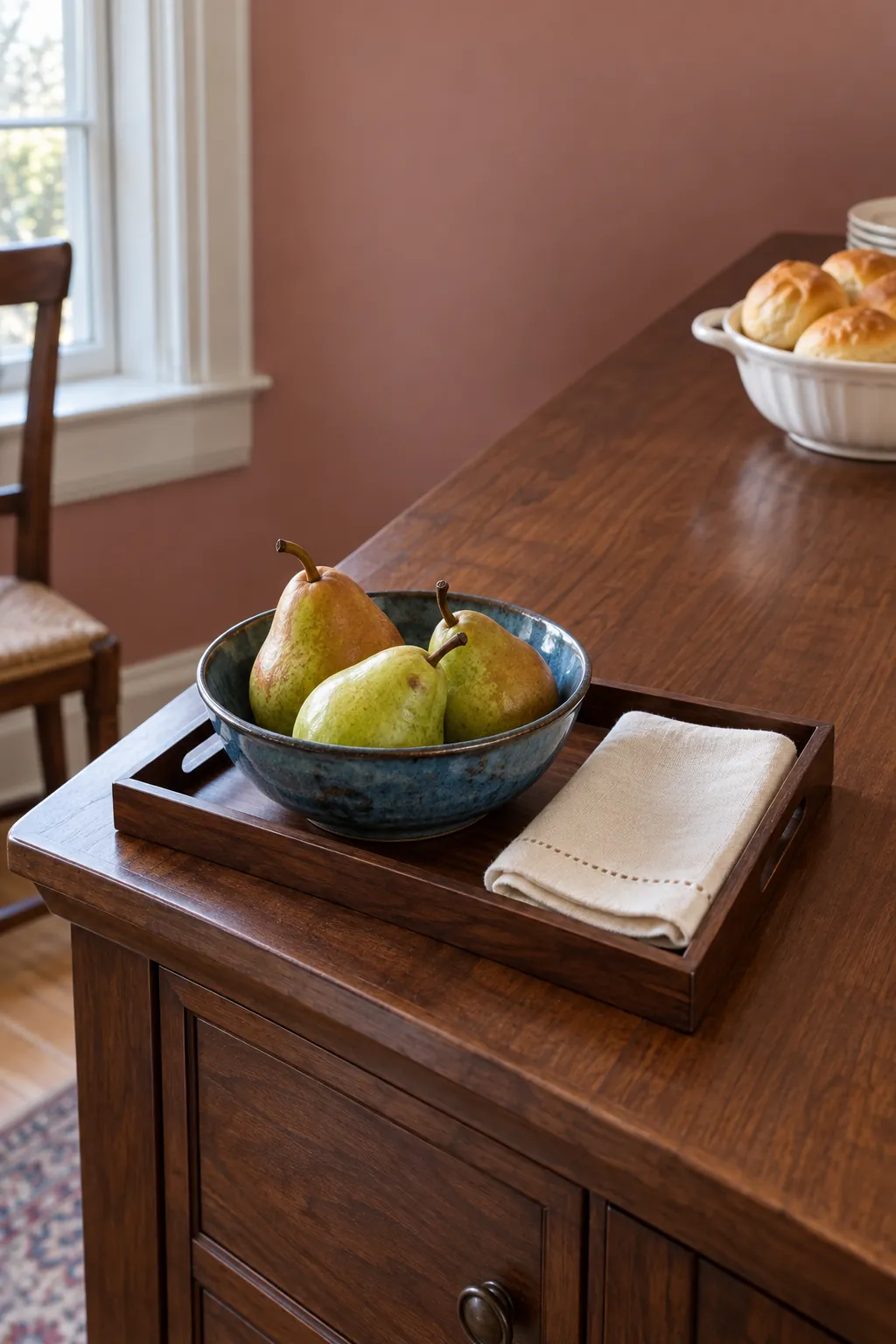 Small tray of pears at the quiet end of a Thanksgiving buffet