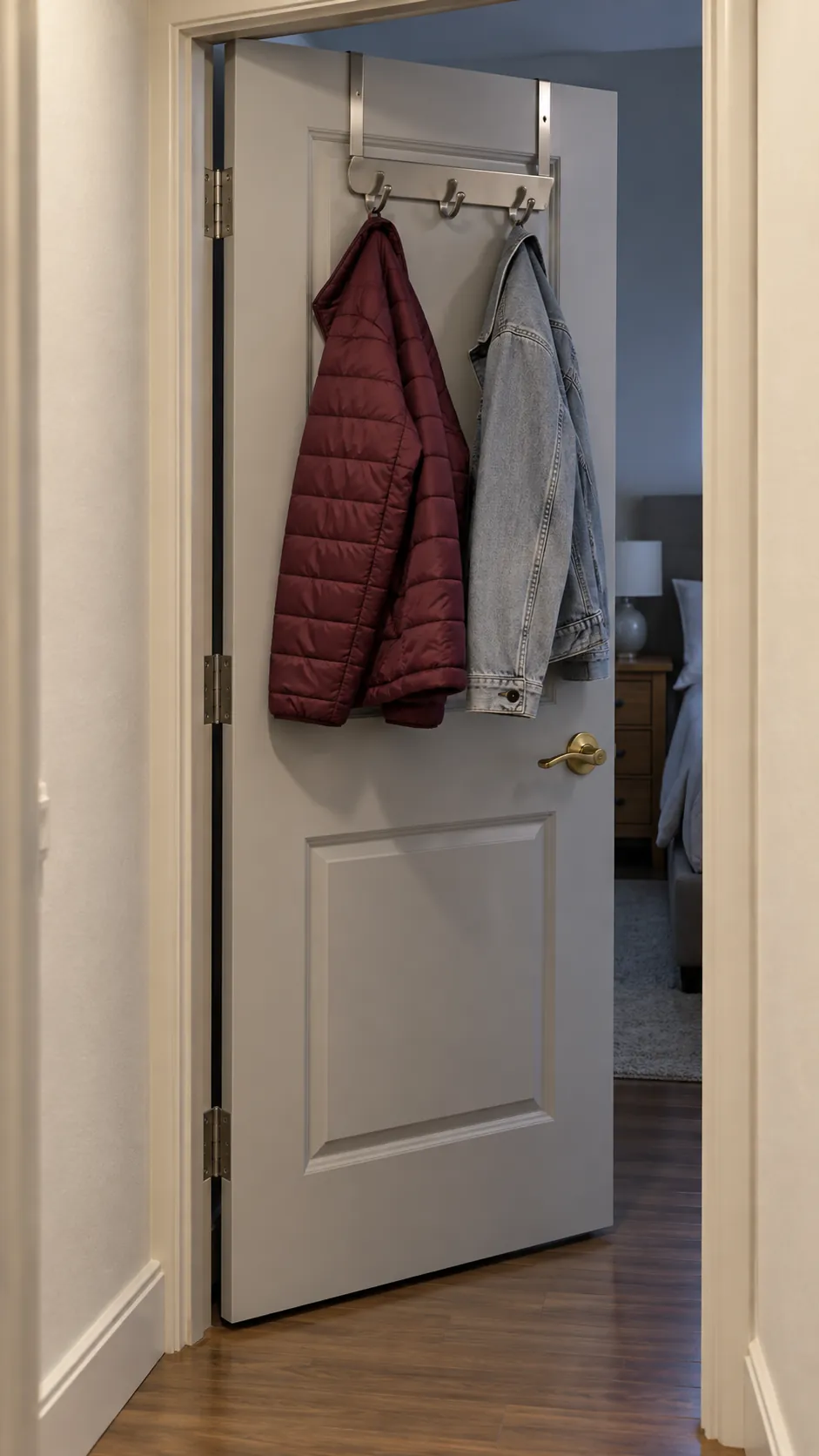 Two coats on a properly fitted rack over an interior door